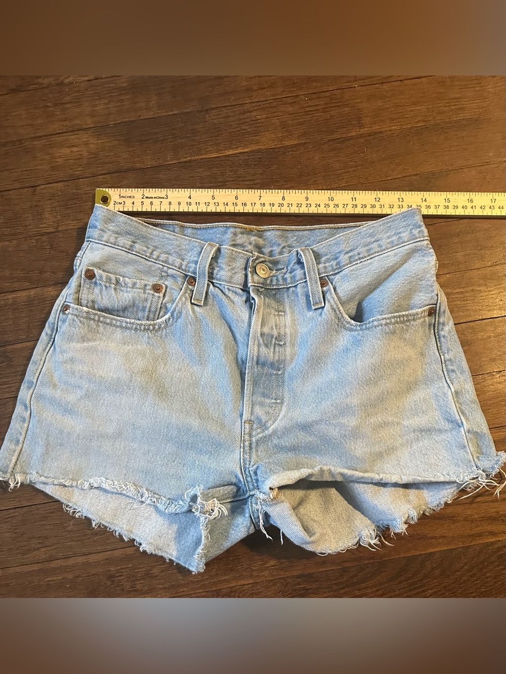 501 Levi light denim cut off shorts size 27